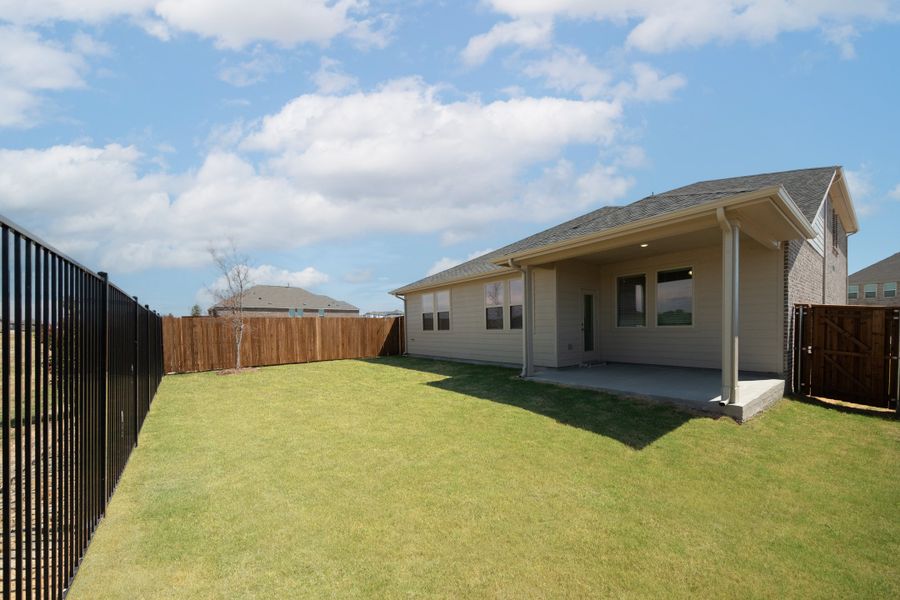 Exterior details and patio area of a home in The Villages of Hurricane Creek, Anna (Image 2).