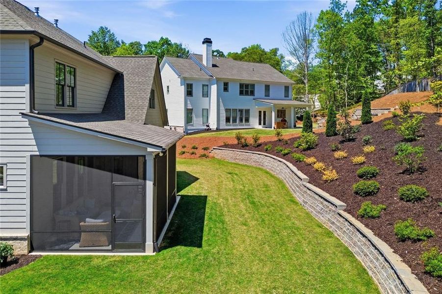 Exterior details and patio area of a home in Malone's Pond, Ball Ground (Image 4).