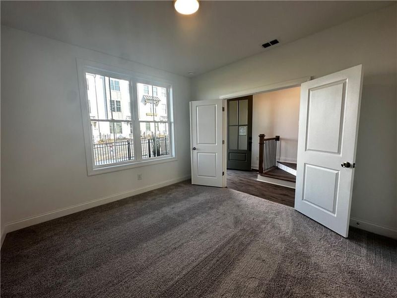 Terrace Level Bedroom has beautiful views of front yard