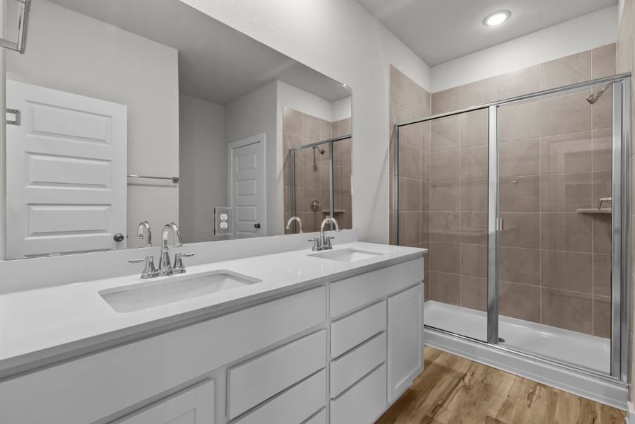 A bathroom with a glass shower.