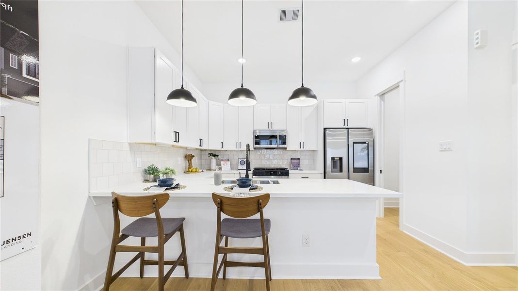 This beautifully designed open-concept kitchen is the perfect blend of style and functionality. Featuring a spacious kitchen peninsula, sleek stainless steel appliances, and ample countertop space, it offers a modern cooking and entertaining experience. The open layout seamlessly connects to the living and dining areas, creating a welcoming environment ideal for gatherings or everyday meals. Thoughtful design elements, quality finishes, and generous workspace make this kitchen a true standout in any home. This beautifully designed open-concept kitchen is the perfect blend of style and functionality. Featuring a spacious kitchen peninsula, sleek stainless steel appliances, and ample countertop space, it offers a modern cooking and entertaining experience. The open layout seamlessly connects to the living and dining areas, creating a welcoming environment ideal for gatherings or everyday meals. Thoughtful design elements, quality finishes, and generous workspace make this kitchen a true standout in any home.