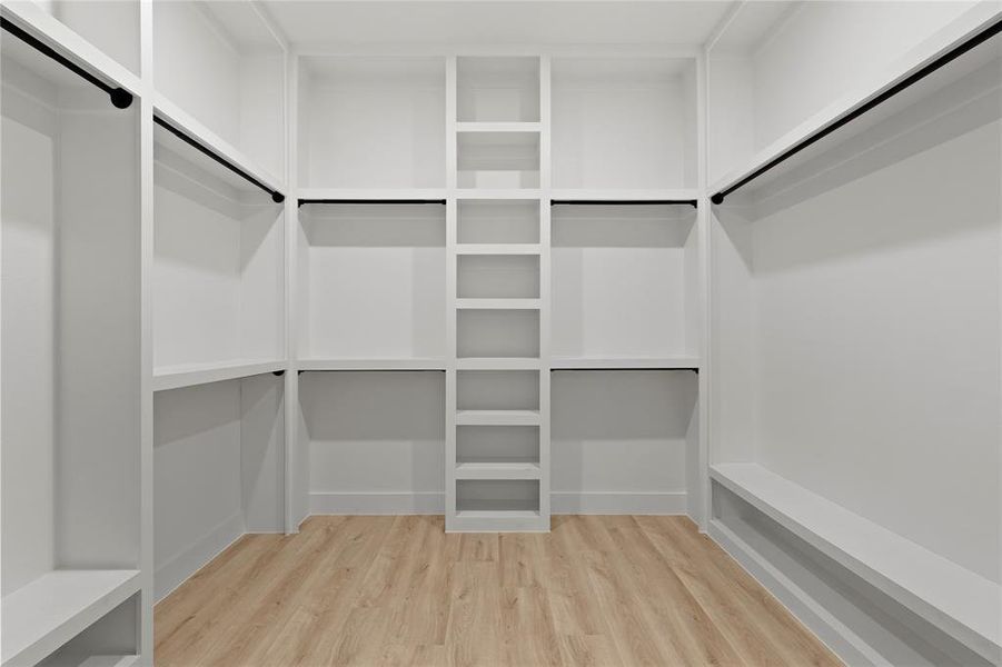 Spacious closet featuring wood finished floors Spacious closet featuring wood finished floors