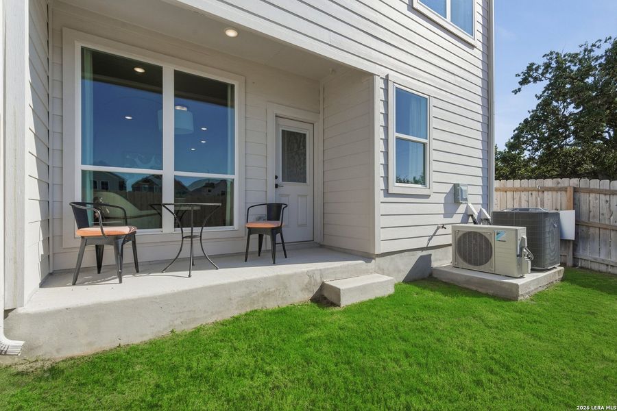 Exterior details and patio area of a home in Centero at Stone Oak, San Antonio (Image 3).