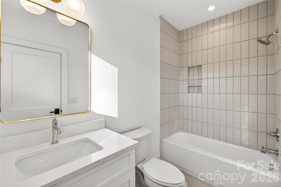 Bathroom #2, Upper.  Full bathtub, rainforest shower head, beautiful rectangular mirror, 2-light light fixture.