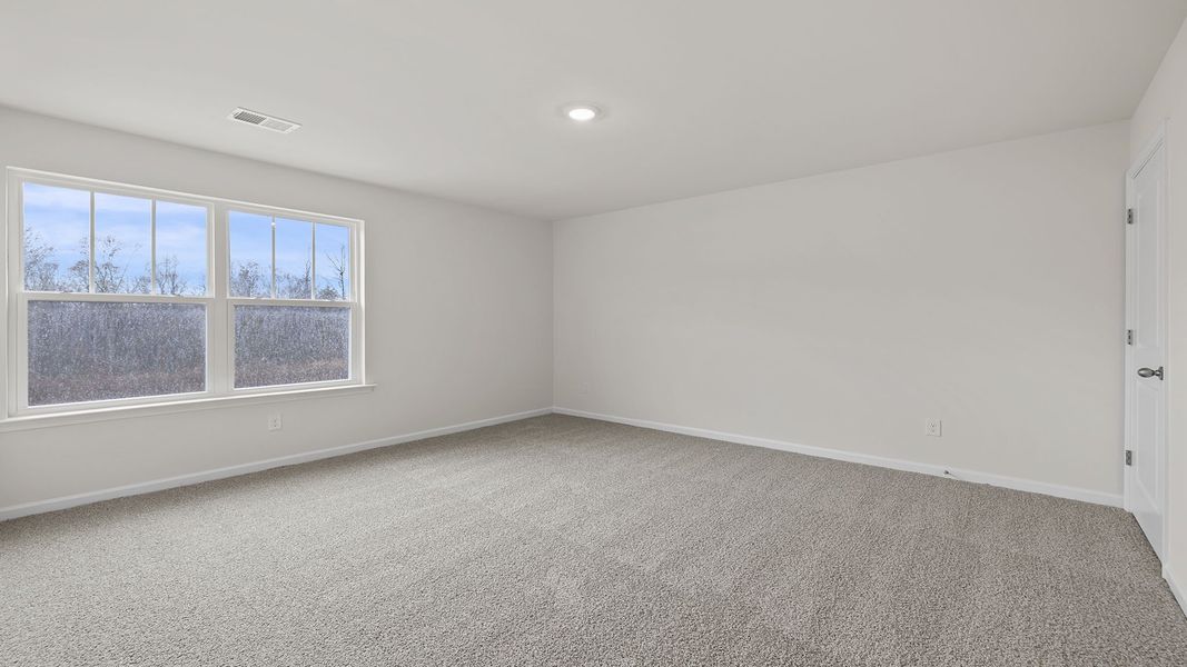Spacious, unfurnished interior of a new home in Bentley Park, Greenwood (Image 24).
