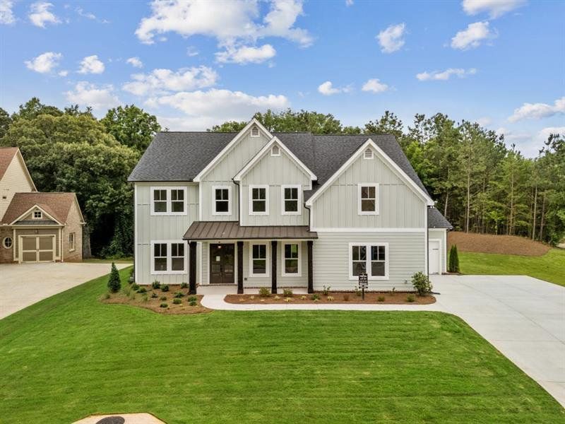Front exterior of a new home in White Post on Lake Lanier, Gainesville, GA, highlighting curb appeal (Image 17). Front exterior of a new home in White Post on Lake Lanier, Gainesville, GA, highlighting curb appeal (Image 17).