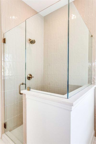 Full bathroom with walk in shower and tile walls Full bathroom with walk in shower and tile walls