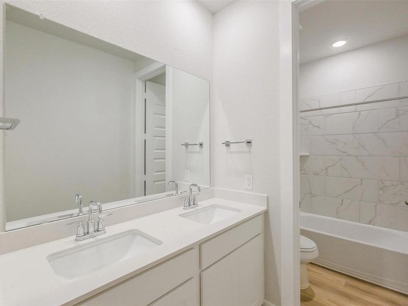 Furnished interior view inside a new home in Sunterra, Katy (Image 12).