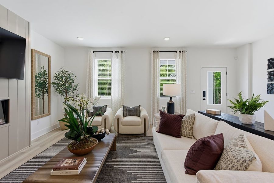 A living room with a couch and a table.