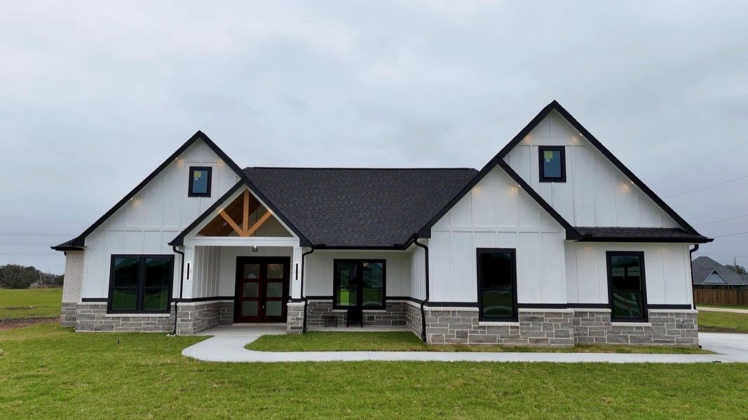 Front exterior of a new home in , Angleton, TX, highlighting curb appeal (Image 12). Front exterior of a new home in , Angleton, TX, highlighting curb appeal (Image 12).