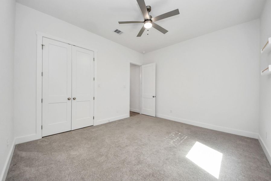 Secondary bedroom with great natural light and closet space.