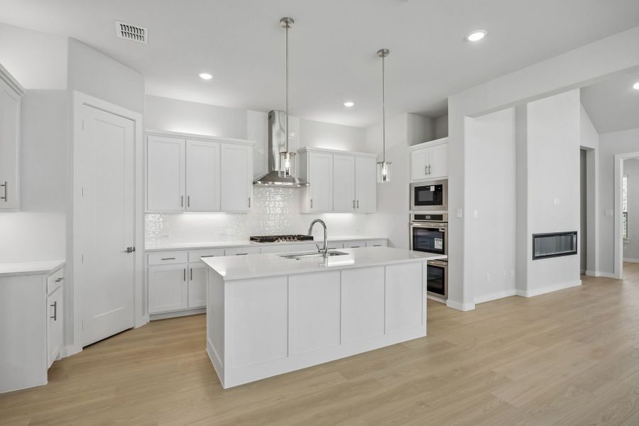 Kitchen in the Picasso II home plan by Trophy Signature Homes – REPRESENTATIVE PHOTO Kitchen in the Picasso II home plan by Trophy Signature Homes – REPRESENTATIVE PHOTO