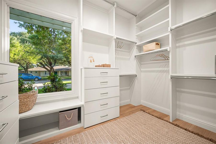 Spacious closet featuring light wood-type flooring