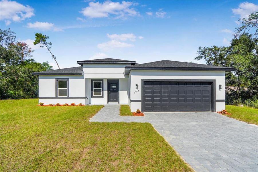 Front exterior of a new home in , Ocala, FL, highlighting curb appeal (Image 1). Front exterior of a new home in , Ocala, FL, highlighting curb appeal (Image 1).