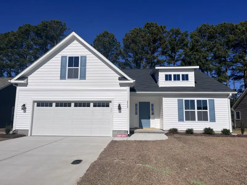 Front exterior of a new home in Davenport Farms, Winterville, NC, highlighting curb appeal (Image 1).