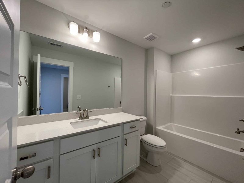 Furnished interior view inside a new home in The Grove at Kennesaw Farms, Gallatin (Image 7).
