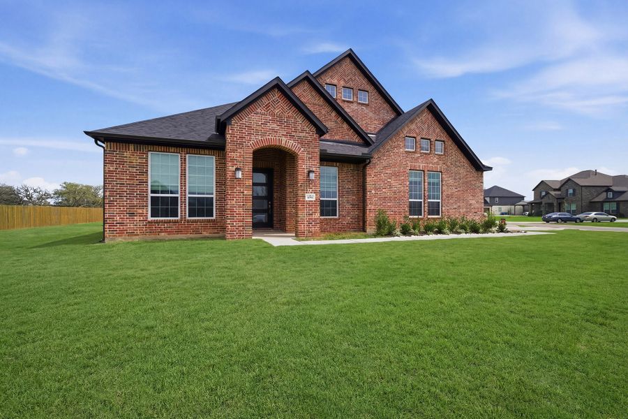 Front exterior of a new home in Suncreek Estates, Rosharon, TX, highlighting curb appeal (Image 2). Front exterior of a new home in Suncreek Estates, Rosharon, TX, highlighting curb appeal (Image 2).
