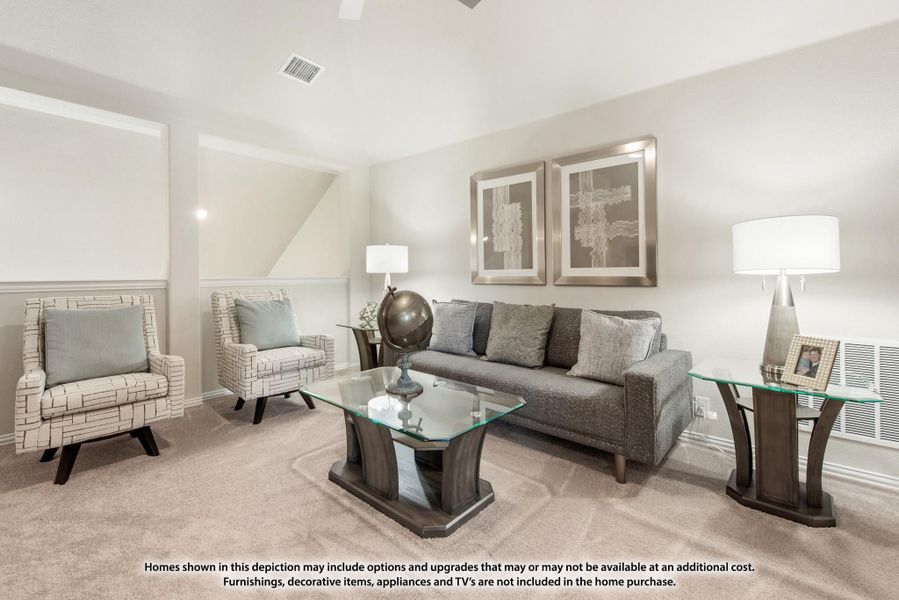 Living room with gray sofa, glass coffee table, two accent chairs, and carpet flooring Living room with gray sofa, glass coffee table, two accent chairs, and carpet flooring