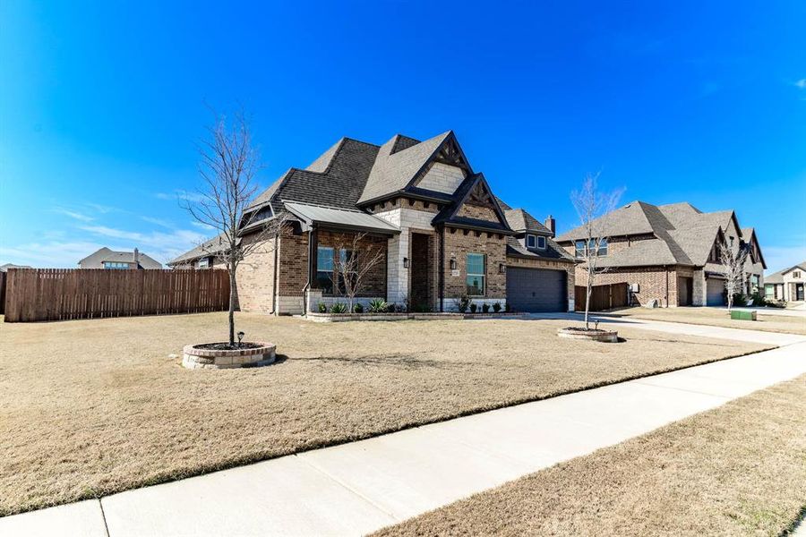 Front exterior of a new home in Coyote Crossing, Godley, TX, highlighting curb appeal (Image 25).