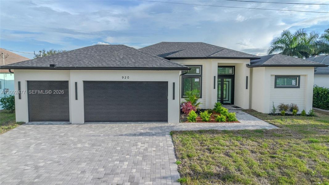 Front exterior of a new home in , Cape Coral, FL, highlighting curb appeal (Image 2). Front exterior of a new home in , Cape Coral, FL, highlighting curb appeal (Image 2).