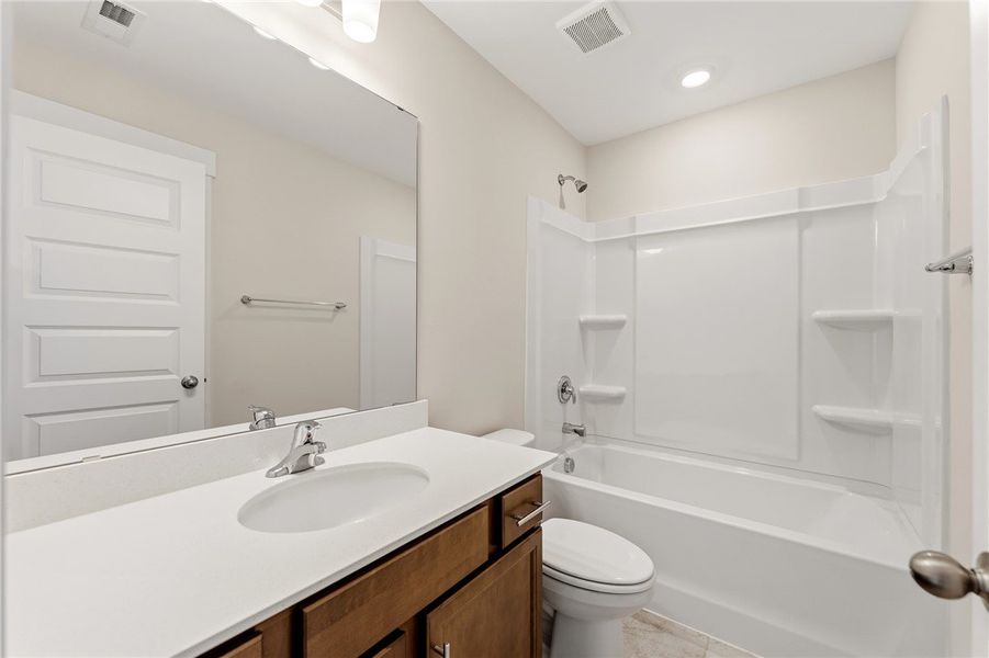 A well-appointed bathroom features a single vanity