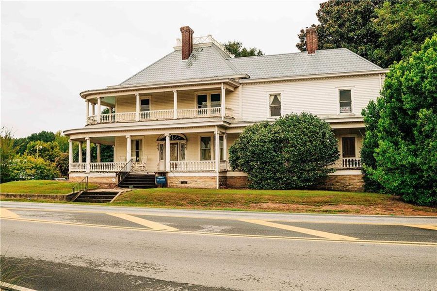Front exterior of a new home in Rosewood Lake Estates, Hoschton, GA, highlighting curb appeal (Image 52).