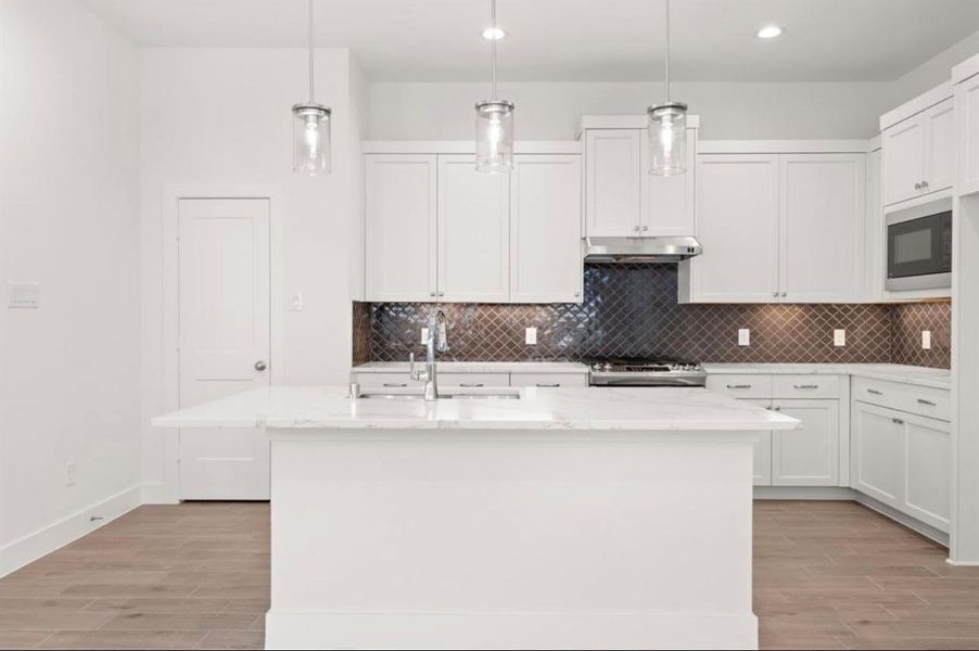 Furnished interior view inside a new home in Sunterra, Katy (Image 5).