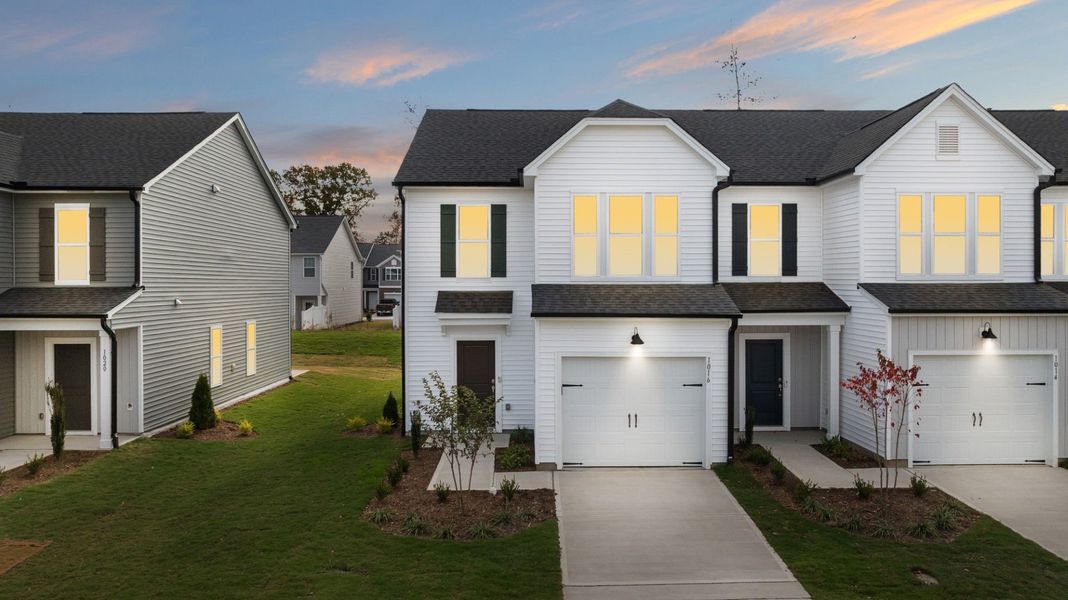 Front exterior of a new home in Poets Walk, Whitsett, NC, highlighting curb appeal (Image 19). Front exterior of a new home in Poets Walk, Whitsett, NC, highlighting curb appeal (Image 19).