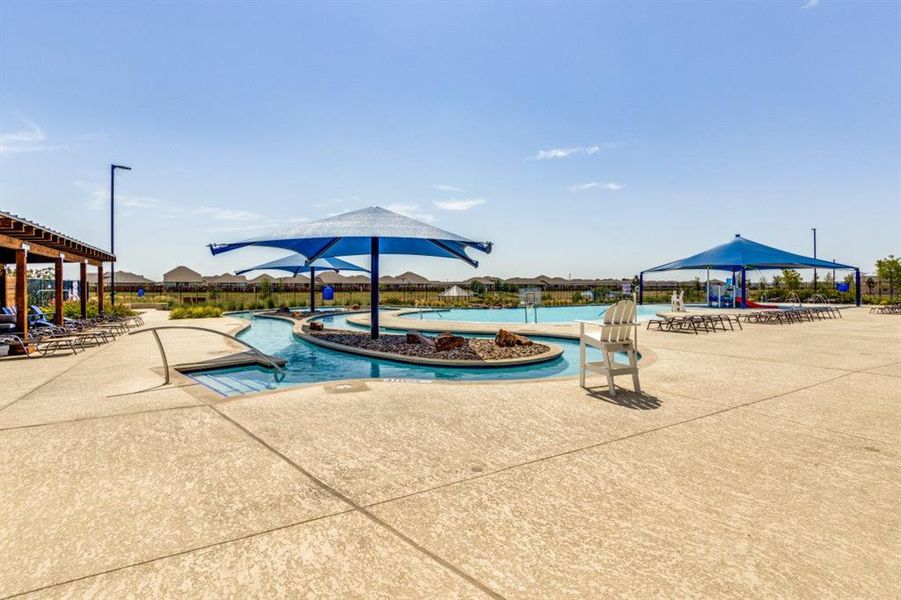 Community pool featuring a patio area and a pergola