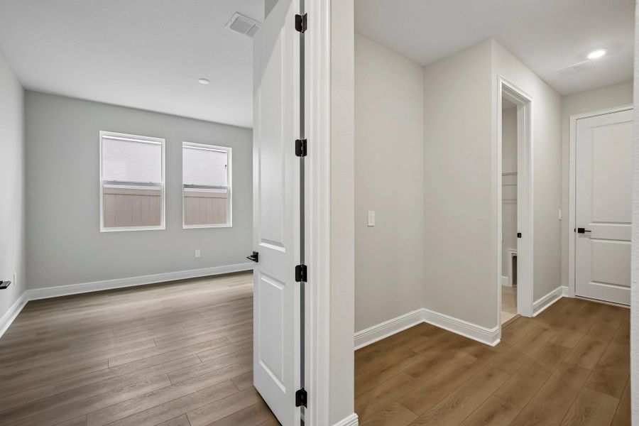 Flex room is off the hallway from the laundry room and access to the double car garage