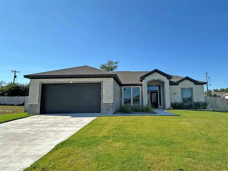 Ranch-style house featuring brick siding, driveway, a garage, and a shingled roof Ranch-style house featuring brick siding, driveway, a garage, and a shingled roof