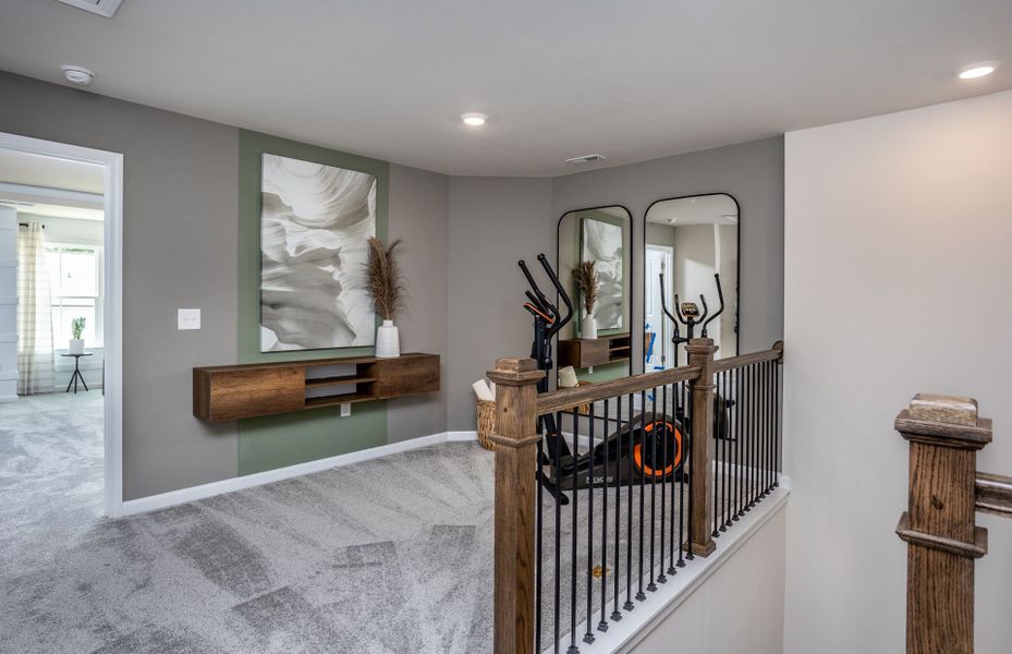 Furnished interior view inside a new home in Exchange at 401, Raleigh (Image 6).
