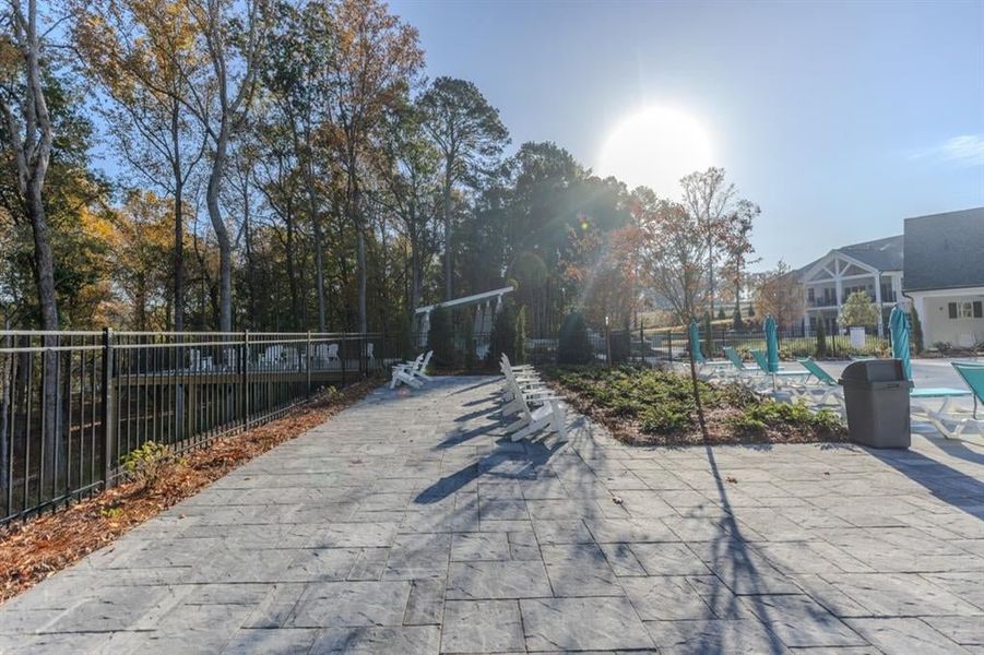 Sun deck with additional seating along the border of the pool. Views of the Chattahoochee and across River Pines Golf Course