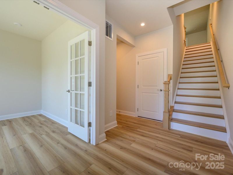 Front Entry With Open Rail and Hard Wood Stairs