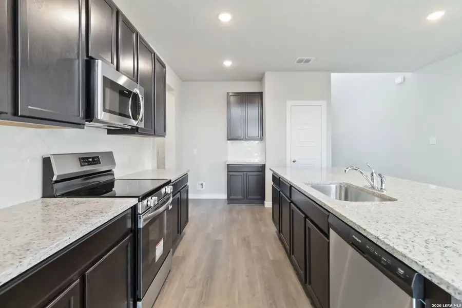 Furnished interior view inside a new home in Hunters Ranch, San Antonio (Image 7).