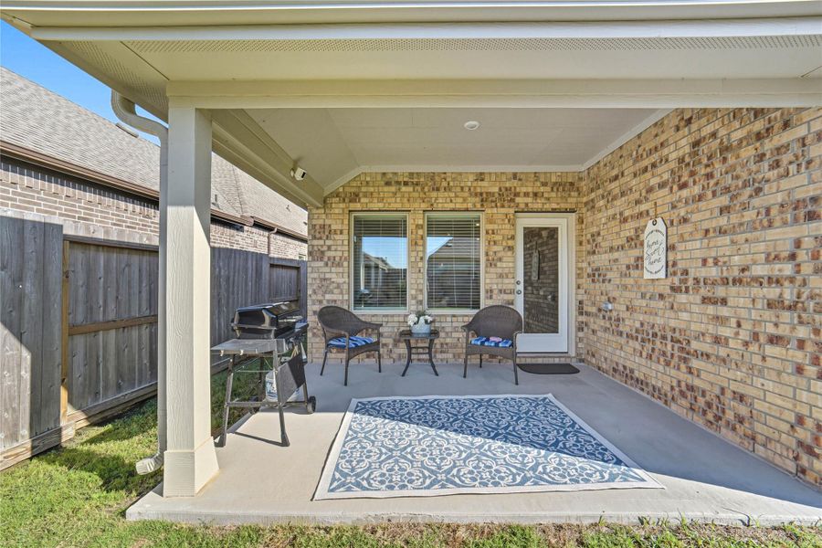 A cozy covered patio, ideal for relaxation or entertaining. A cozy covered patio, ideal for relaxation or entertaining.