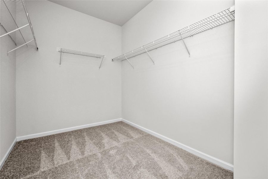 The Coleman- Primary Walk-in Closet. Home under construction, photo used for illustrative purposes only, colors and options will vary. The Coleman- Primary Walk-in Closet. Home under construction, photo used for illustrative purposes only, colors and options will vary.