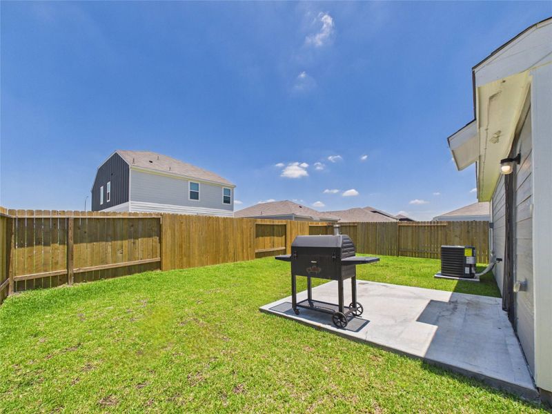 Exterior details and patio area of a home in Park Vista at El Tesoro, Houston (Image 26).
