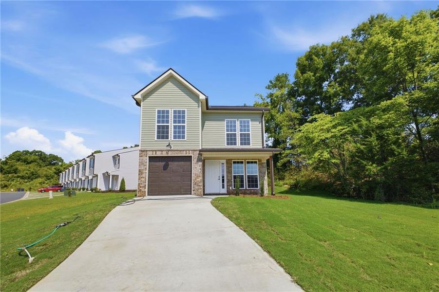 Front exterior of a new home in , Calhoun, GA, highlighting curb appeal (Image 2). Front exterior of a new home in , Calhoun, GA, highlighting curb appeal (Image 2).