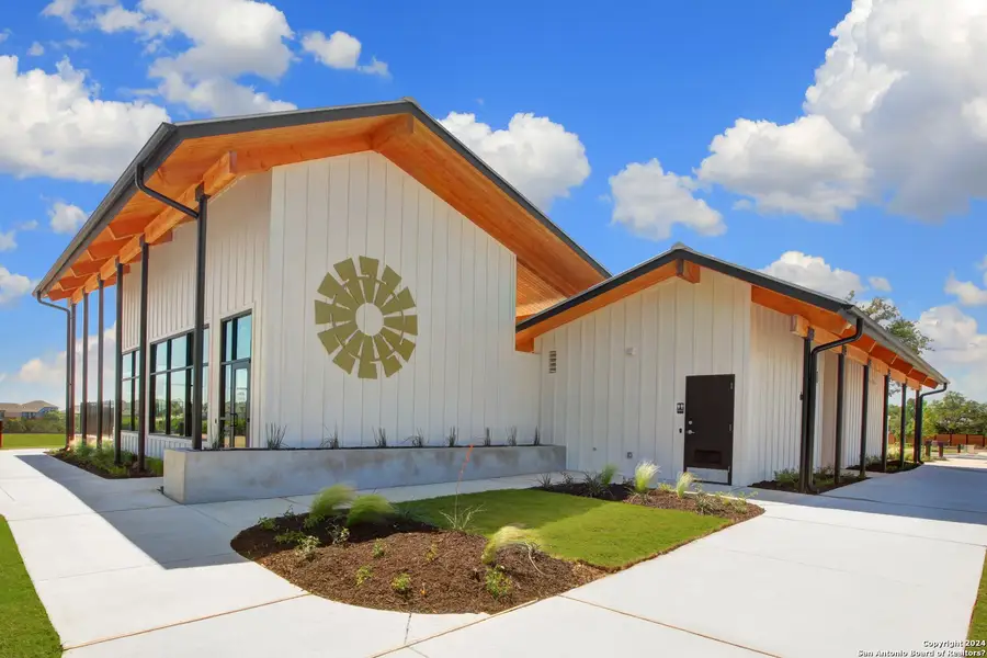 Front exterior of a new home in Meyer Ranch, New Braunfels, TX, highlighting curb appeal (Image 2).