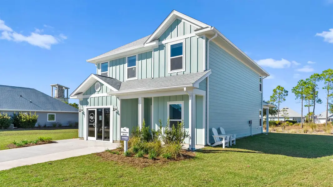 Front exterior of a new home in WindMark Beach, Port Saint Joe, FL, highlighting curb appeal (Image 2). Front exterior of a new home in WindMark Beach, Port Saint Joe, FL, highlighting curb appeal (Image 2).