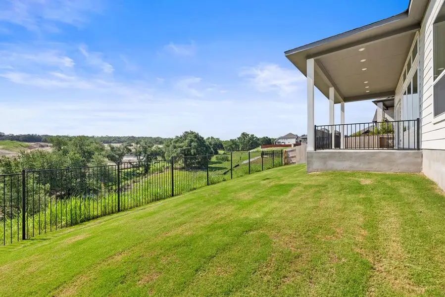 Exterior details and patio area of a home in Lariat, Liberty Hill (Image 25).