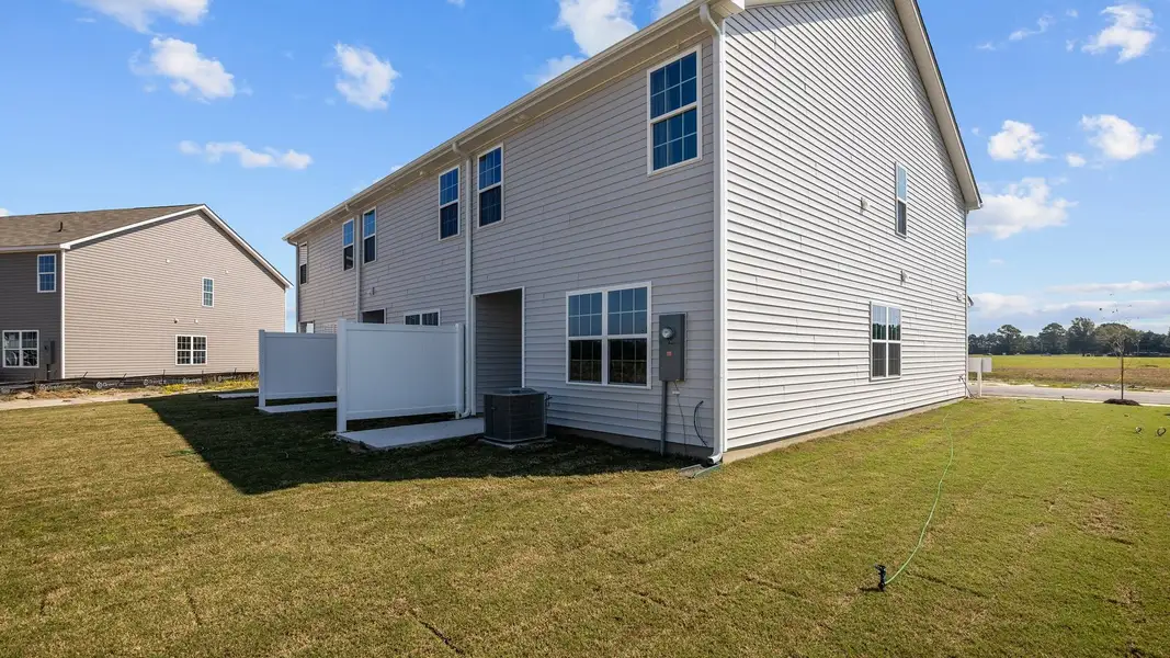 Exterior details and patio area of a home in The Townes at Ridgewood Farms, Winterville (Image 4).