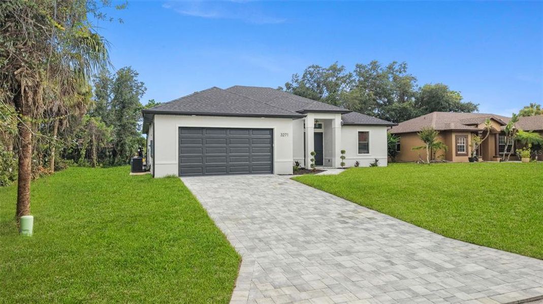 Front exterior of a new home in , North Port, FL, highlighting curb appeal (Image 20). Front exterior of a new home in , North Port, FL, highlighting curb appeal (Image 20).