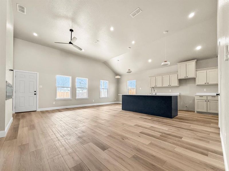 Bathroom with vanity, shower / washtub combination, and light wood-type flooring