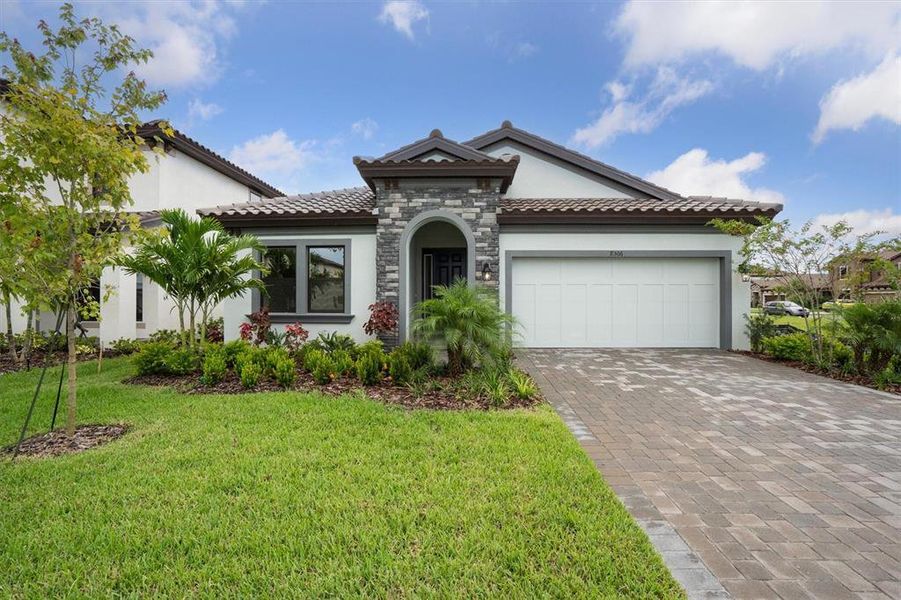 Front exterior of a new home in Crosswind Ranch, Parrish, FL, highlighting curb appeal (Image 16).