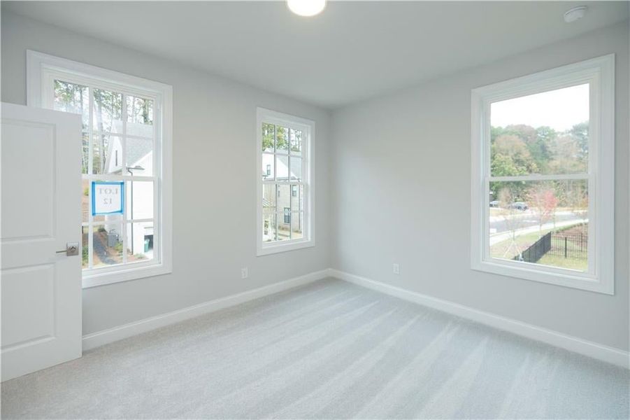 The second of two additional bedrooms located on the second floor. *Please note photos shown are of the Ellington plan but not of the actual home.
