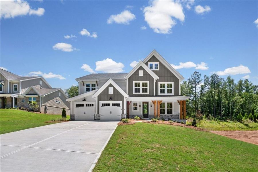 Front exterior of a new home in Woodberry, Canton, GA, highlighting curb appeal (Image 2). Front exterior of a new home in Woodberry, Canton, GA, highlighting curb appeal (Image 2).