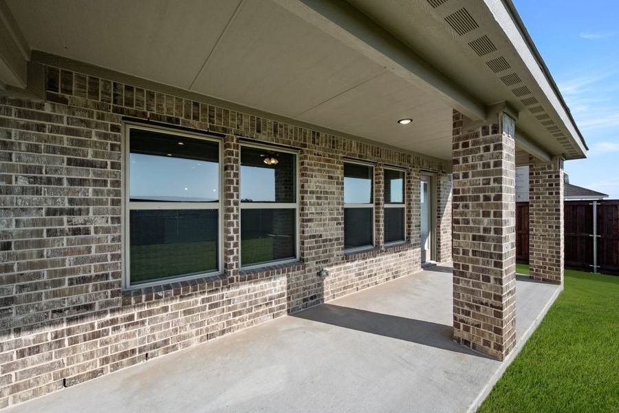 Front exterior of a new home in Myrtle Creek, Waxahachie, TX, highlighting curb appeal (Image 30). Front exterior of a new home in Myrtle Creek, Waxahachie, TX, highlighting curb appeal (Image 30).