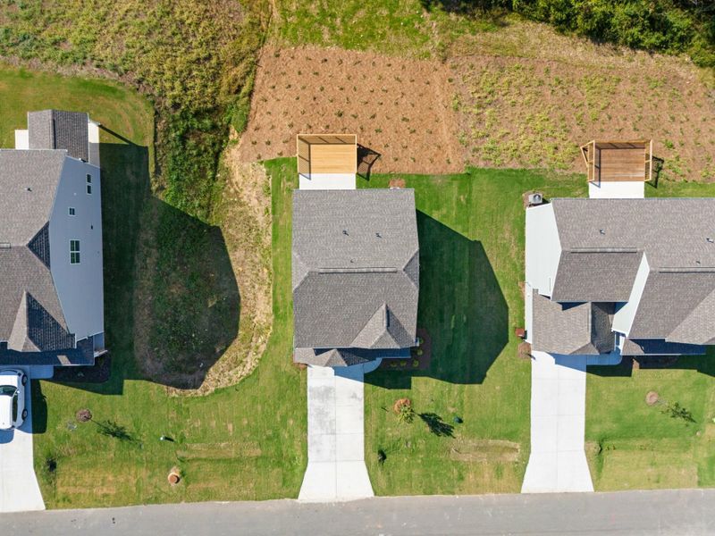 Front exterior of a new home in Cottages at Piper Village, Trinity, NC, highlighting curb appeal (Image 23).